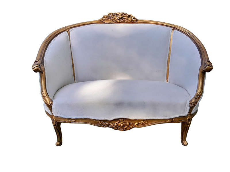A French Style Ornately Carved and Gilded Bergere Chair