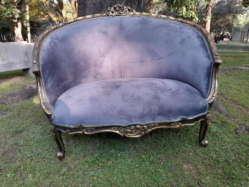 A French Style Ornately Carved and Gilded Bergere Chair
