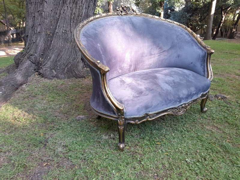 A French Style Ornately Carved and Gilded Bergere Chair