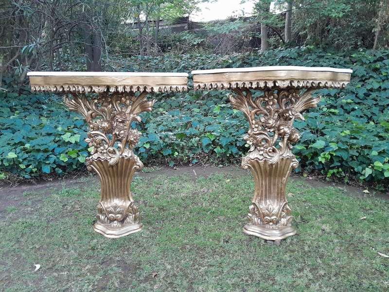 A Pair of Large French Style Carved and Gilded Wall Sconces Or Console Tables with Cream Marble Tops