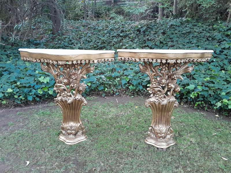 A Pair of Large French Style Carved and Gilded Wall Sconces Or Console Tables with Cream Marble Tops