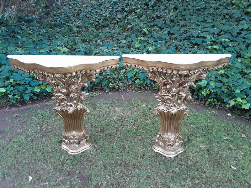A Pair of Large French Style Carved and Gilded Wall Sconces Or Console Tables with Cream Marble Tops