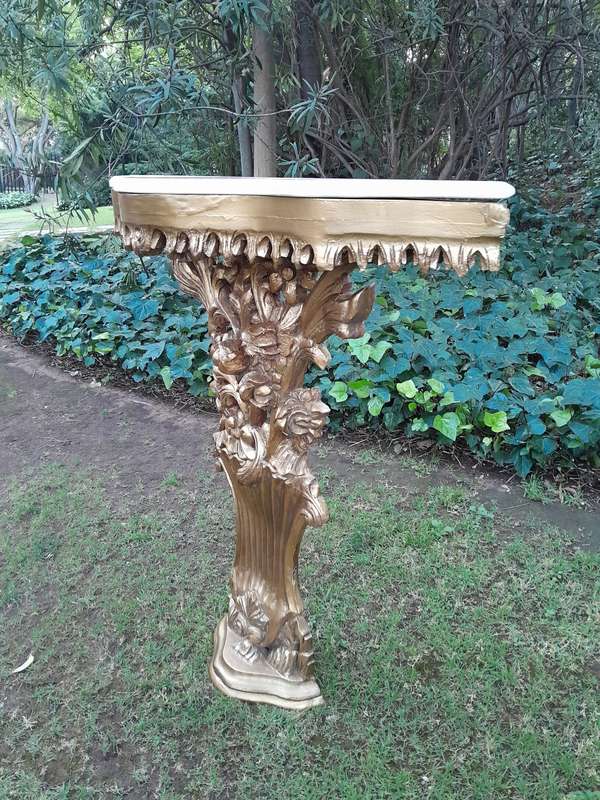 A Pair of Large French Style Carved and Gilded Wall Sconces Or Console Tables with Cream Marble Tops