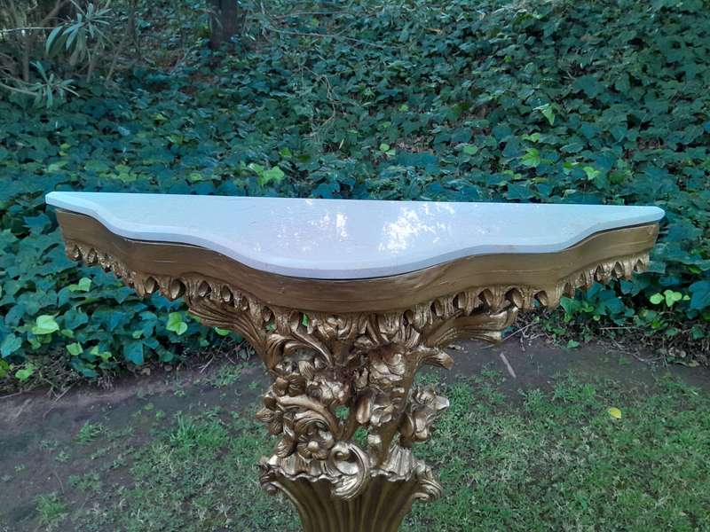 A Pair of Large French Style Carved and Gilded Wall Sconces Or Console Tables with Cream Marble Tops