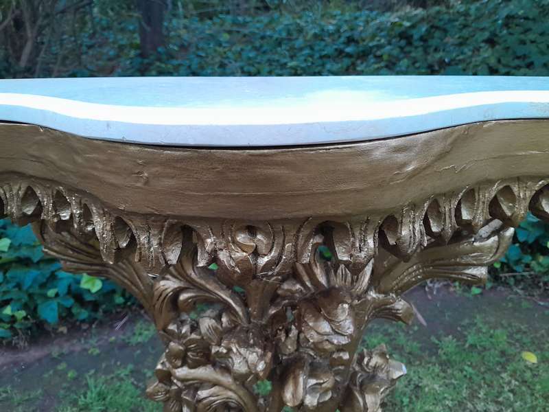 A Pair of Large French Style Carved and Gilded Wall Sconces Or Console Tables with Cream Marble Tops