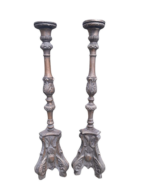 A Pair of French Style Carved and Gilded Floor or Table Candle Holders