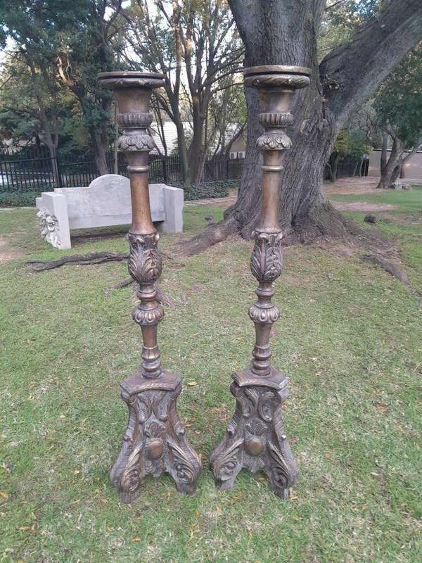 A Pair of French Style Carved and Gilded Floor or Table Candle Holders