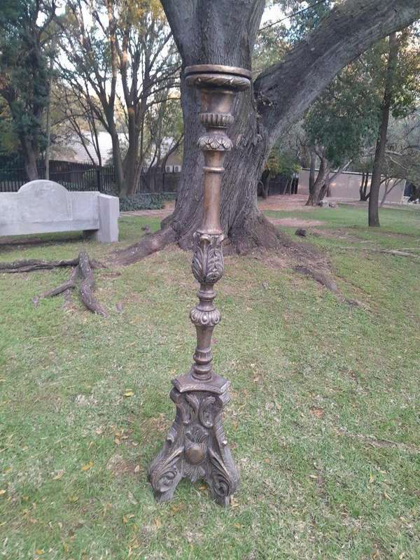 A Pair of French Style Carved and Gilded Floor or Table Candle Holders
