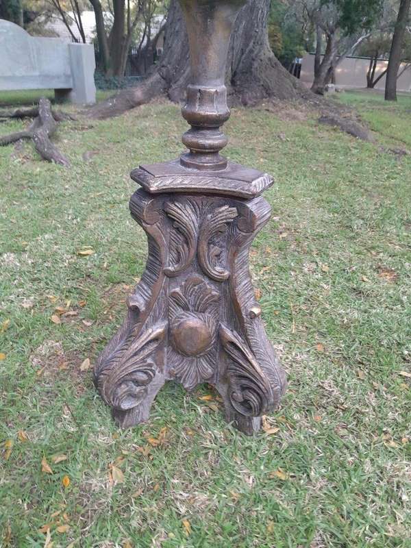 A Pair of French Style Carved and Gilded Floor or Table Candle Holders