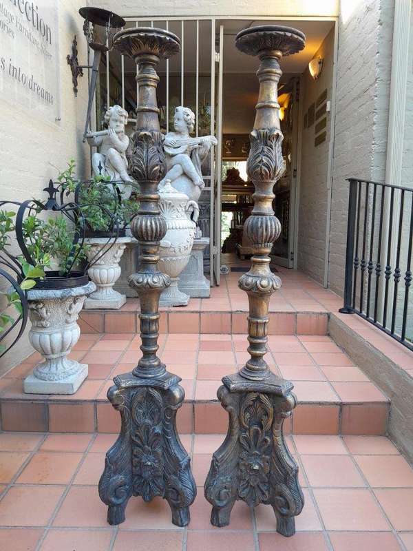 A Pair Of French Style Carved And Gilded Floor Or Table Candle Holders