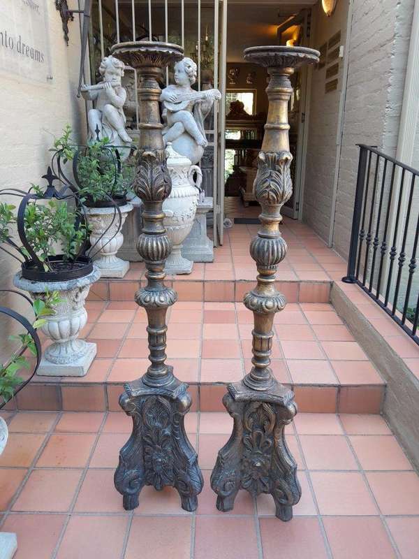 A Pair Of French Style Carved And Gilded Floor Or Table Candle Holders