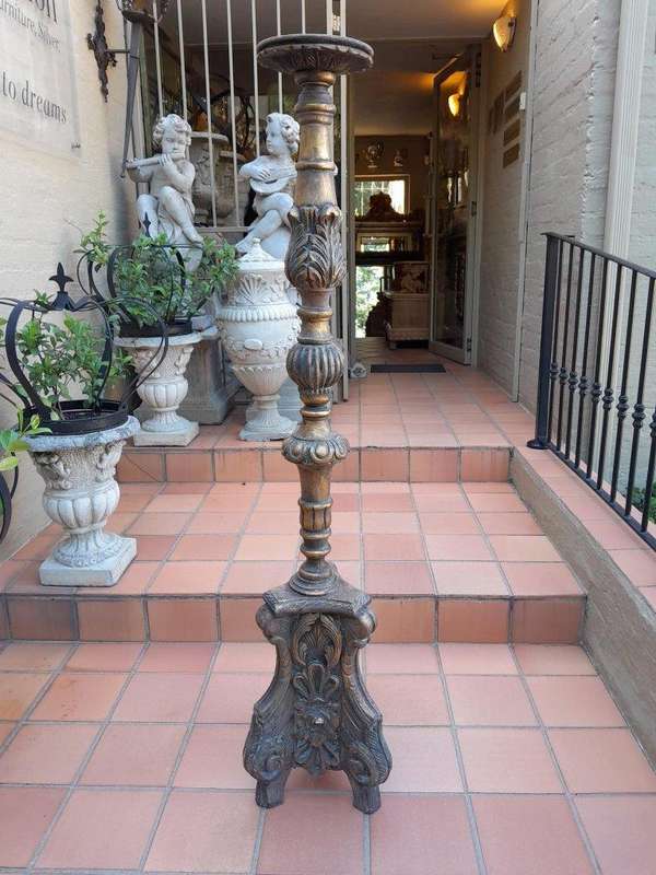 A Pair Of French Style Carved And Gilded Floor Or Table Candle Holders