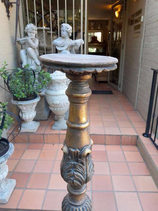 A Pair Of French Style Carved And Gilded Floor Or Table Candle Holders