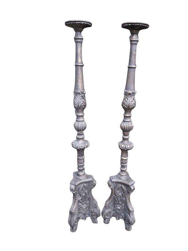 A Pair of French Style Carved and Gilded Floor or Table Candle Holders