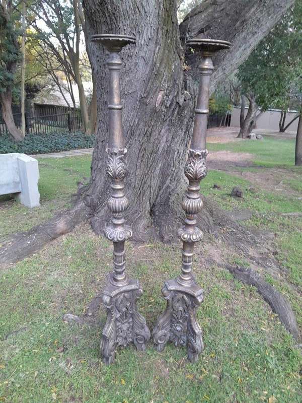 A Pair of French Style Carved and Gilded Floor or Table Candle Holders