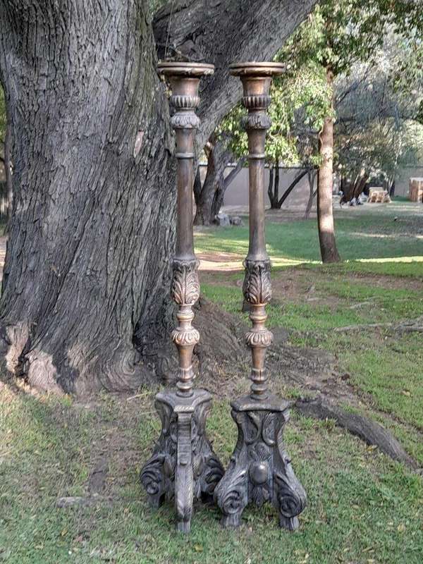 A Pair of French Style Carved and Gilded Floor or Table Candle Holders