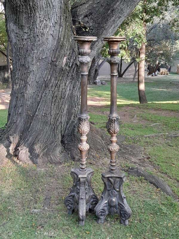A Pair of French Style Carved and Gilded Floor or Table Candle Holders