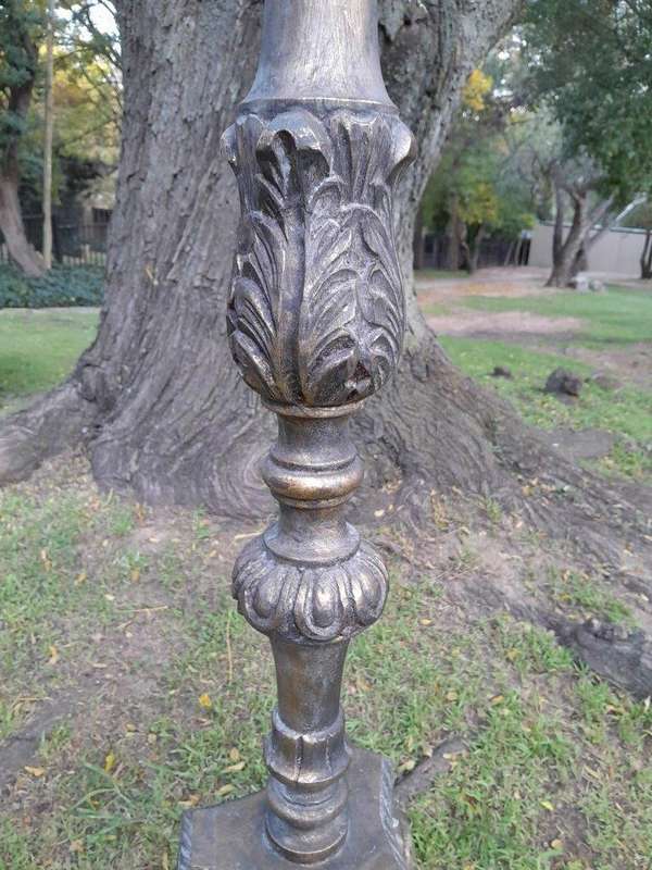 A Pair of French Style Carved and Gilded Floor or Table Candle Holders
