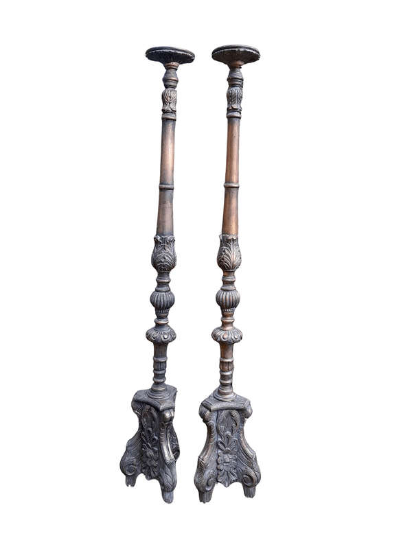A Pair of French Style Carved and Gilded Floor or Table Candle Holders