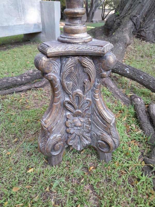 A Pair of French Style Carved and Gilded Floor or Table Candle Holders