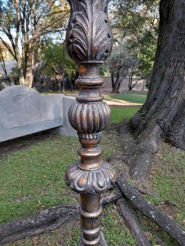 A Pair of French Style Carved and Gilded Floor or Table Candle Holders