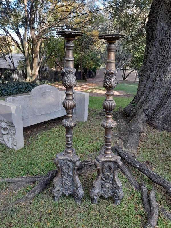 A Pair of French Style Carved and Gilded Floor or Table Candle Holders