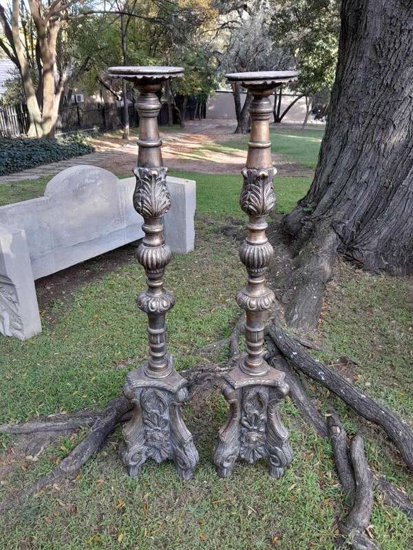 A Pair of French Style Carved and Gilded Floor or Table Candle Holders