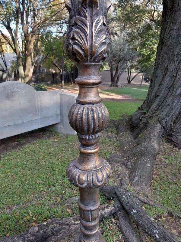 A Pair of French Style Carved and Gilded Floor or Table Candle Holders