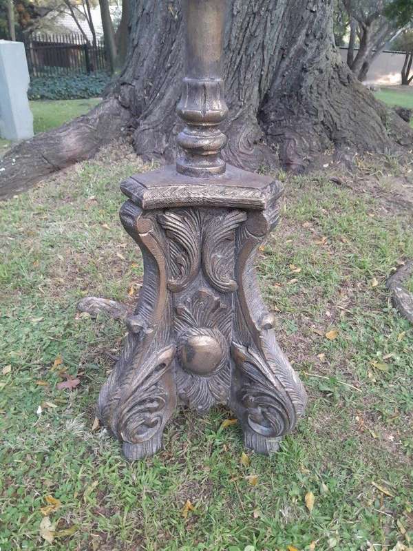 A Pair of French Style Carved and Gilded Floor or Table Candle Holders