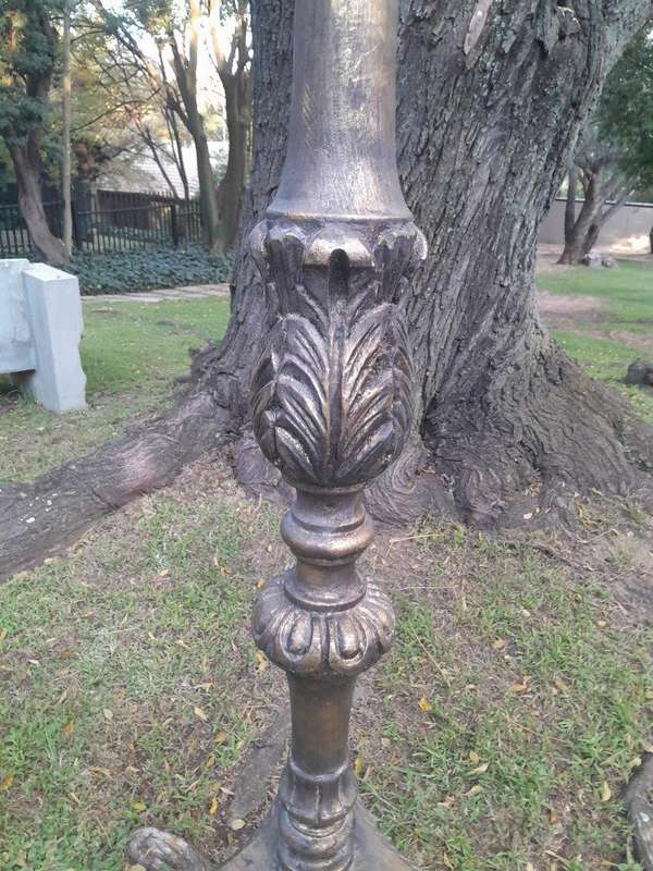 A Pair of French Style Carved and Gilded Floor or Table Candle Holders