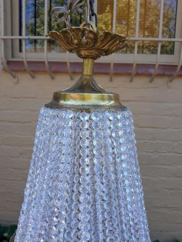 A French Empire Style Brass & Crystal Chandelier