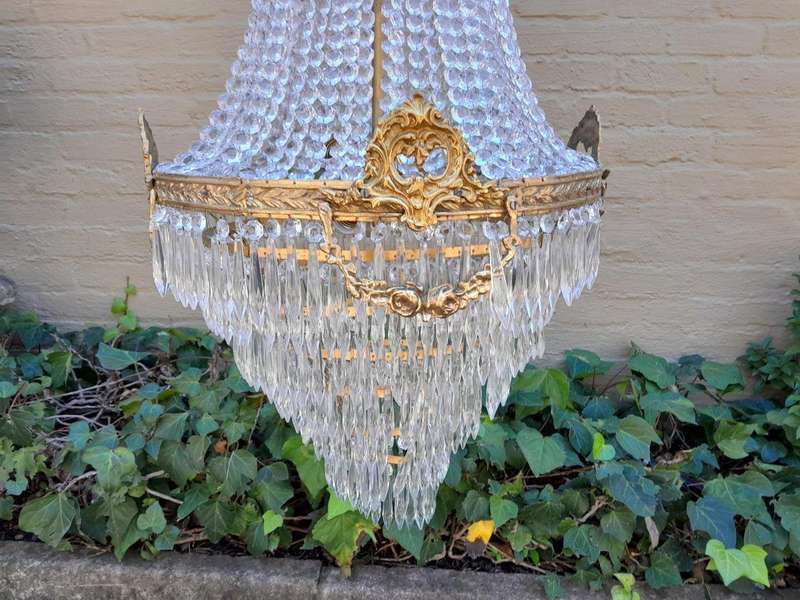 A French Empire Style Brass & Crystal Chandelier