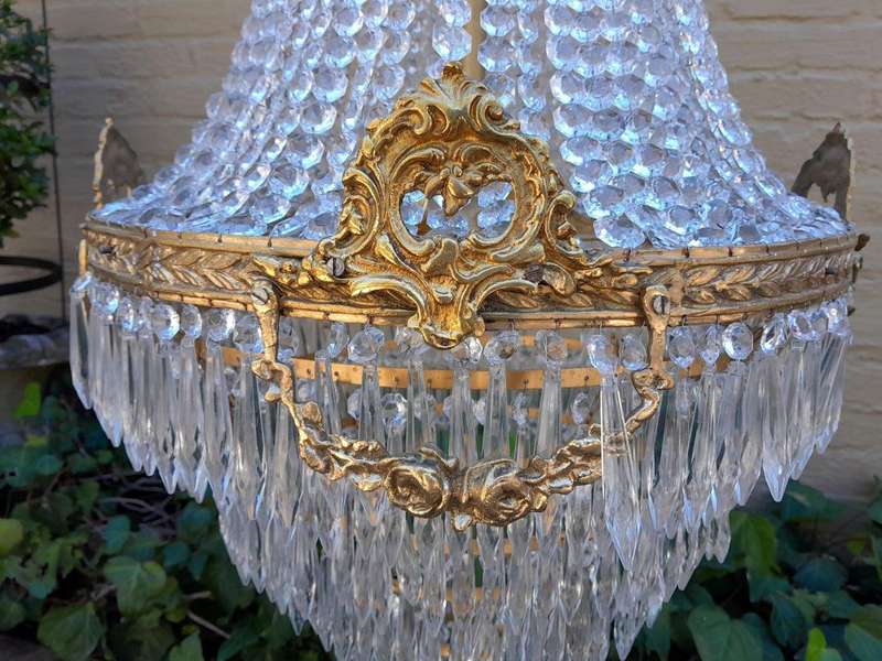 A French Empire Style Brass & Crystal Chandelier