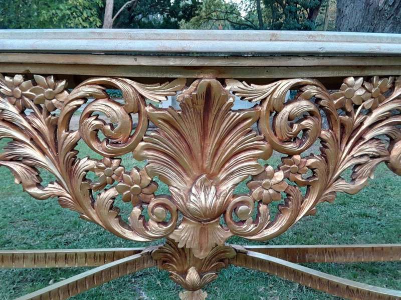A 20th Century Ornately Carved and Hand-Gilded Console Table of Large Proportion with Cream Marbl...
