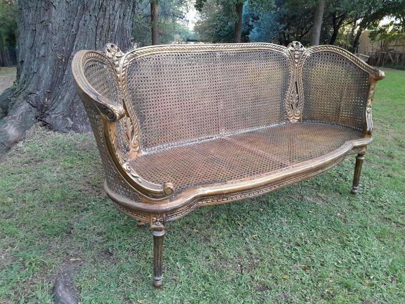 A French Louis XVI Style Carved and Giltwood Rattan Settee