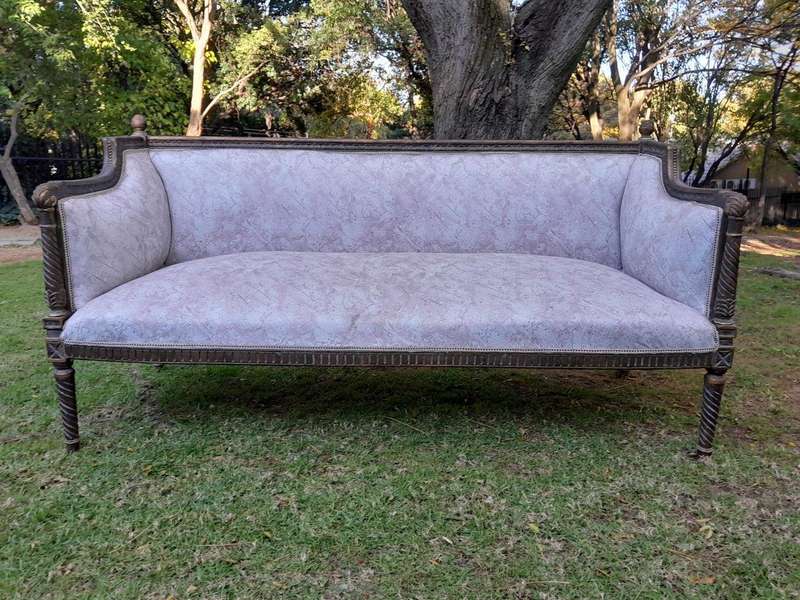 A French Louis XVI Style Large Carved Giltwood Settee