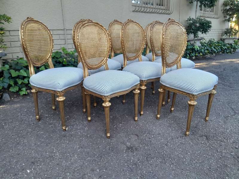 A Set of Eight French Style Carved Balloon and Rattan Back Chairs Upholstered in a Contemporary F...
