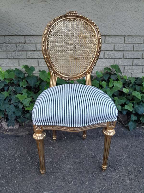 A Set of Eight French Style Carved Balloon and Rattan Back Chairs Upholstered in a Contemporary F...