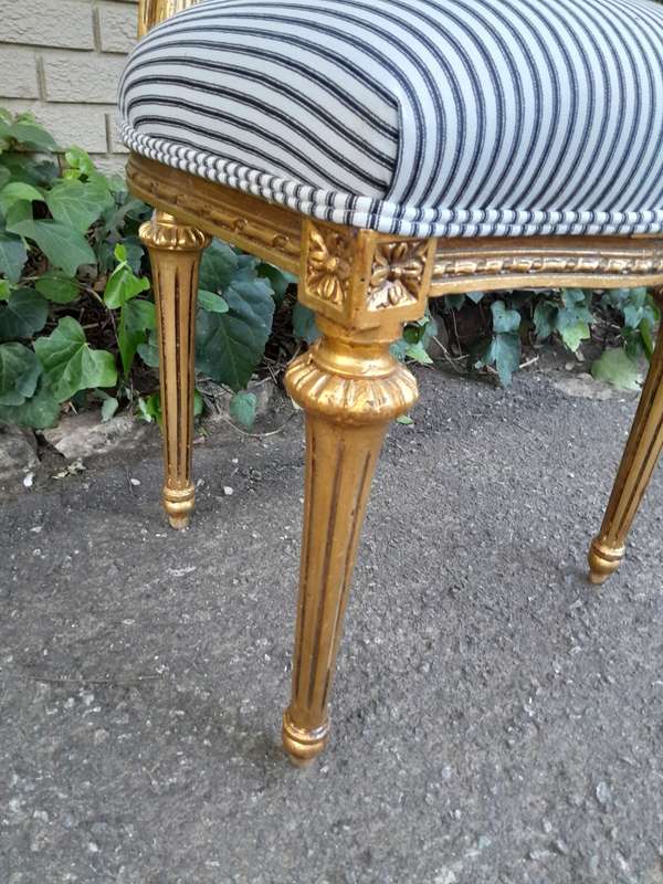 A Set of Eight French Style Carved Balloon and Rattan Back Chairs Upholstered in a Contemporary F...