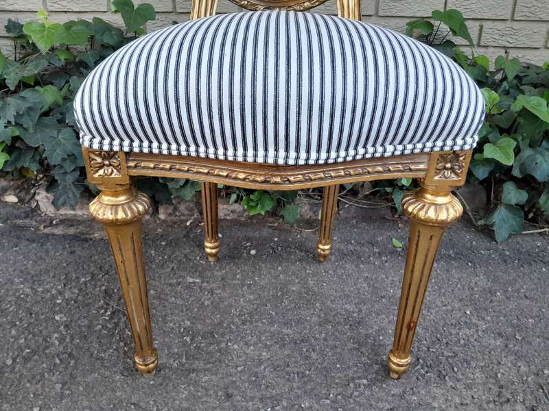 A Set of Eight French Style Carved Balloon and Rattan Back Chairs Upholstered in a Contemporary F...
