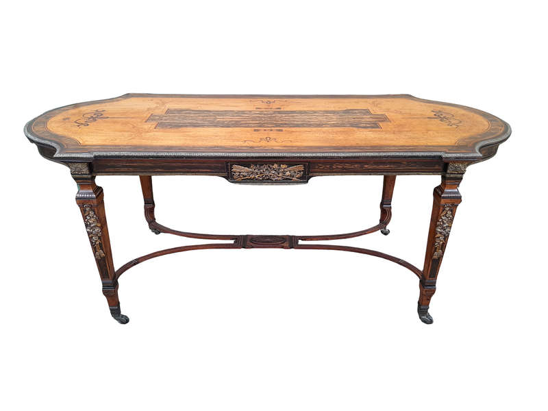 A Napoleon Marquetry Table On Castors