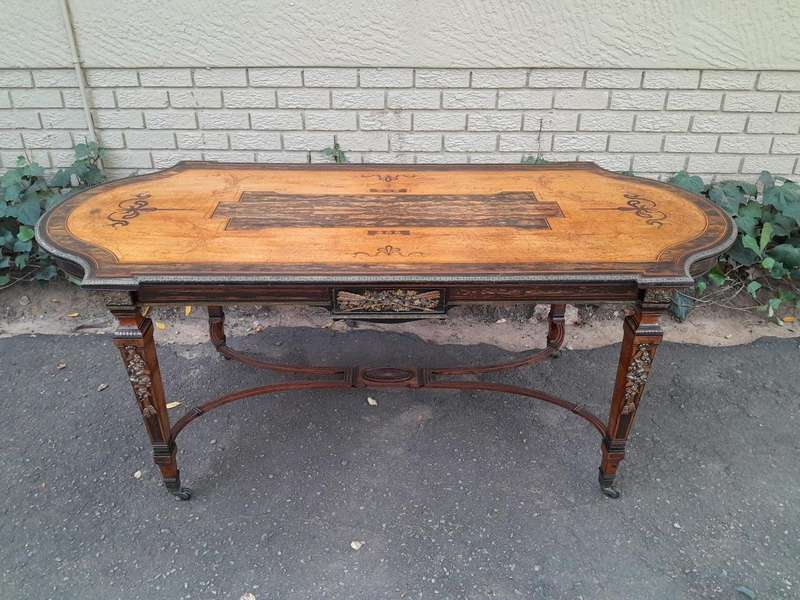 A Napoleon Marquetry Table On Castors