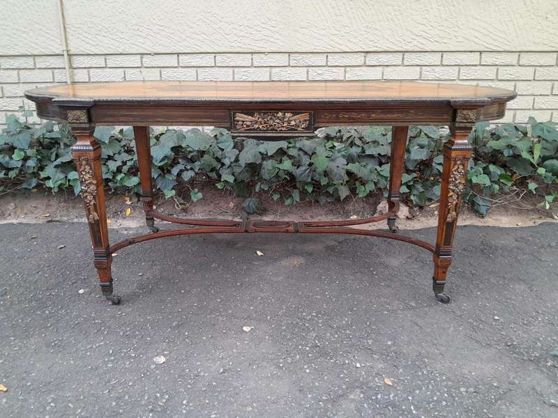 A Napoleon Marquetry Table On Castors