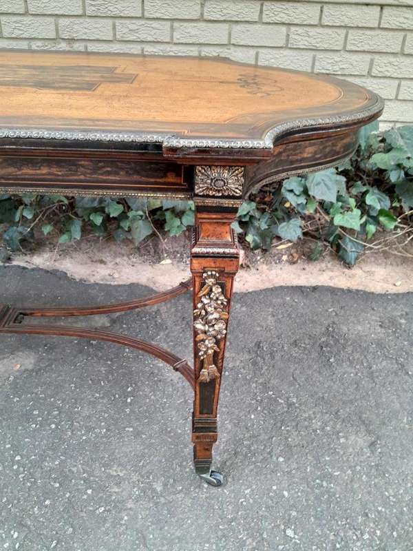 A Napoleon Marquetry Table On Castors