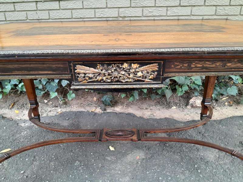 A Napoleon Marquetry Table On Castors
