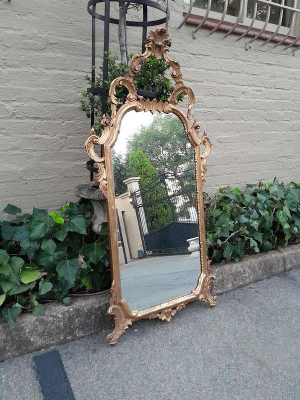 A 19th Century Rococo Style Ornately Carved Gilt Wood Mirror