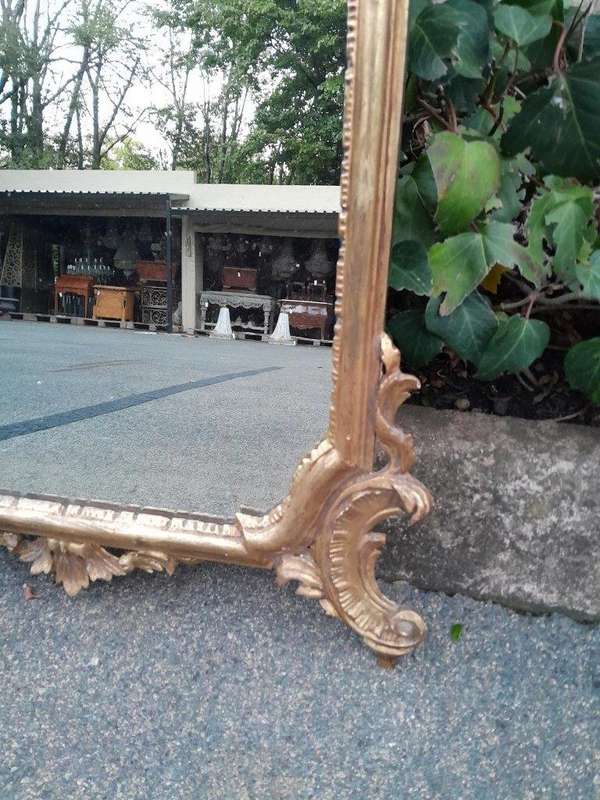 A 19th Century Rococo Style Ornately Carved Gilt Wood Mirror