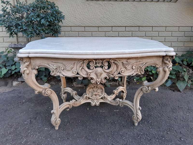 A 19th Century Ornately Carved Rococo Style Table with Marble Top in a Contemporary Bleached / Na...