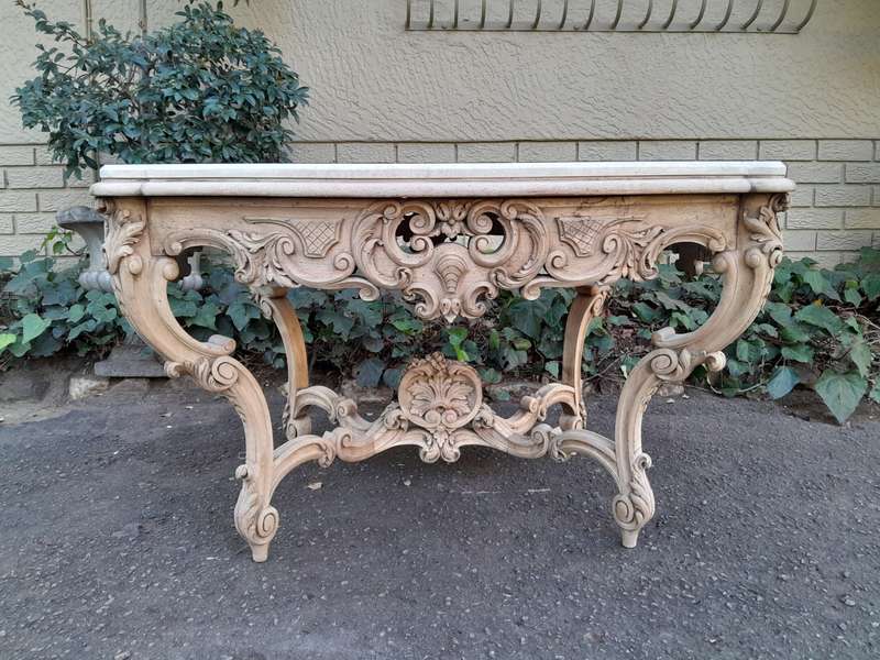 A 19th Century Ornately Carved Rococo Style Table with Marble Top in a Contemporary Bleached / Na...