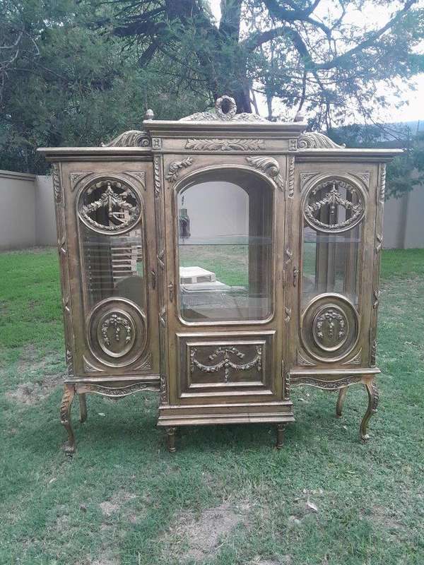 A 20th Century French Style Three Division and Large Ornately Carved and Hand-Gilded Display Cabinet